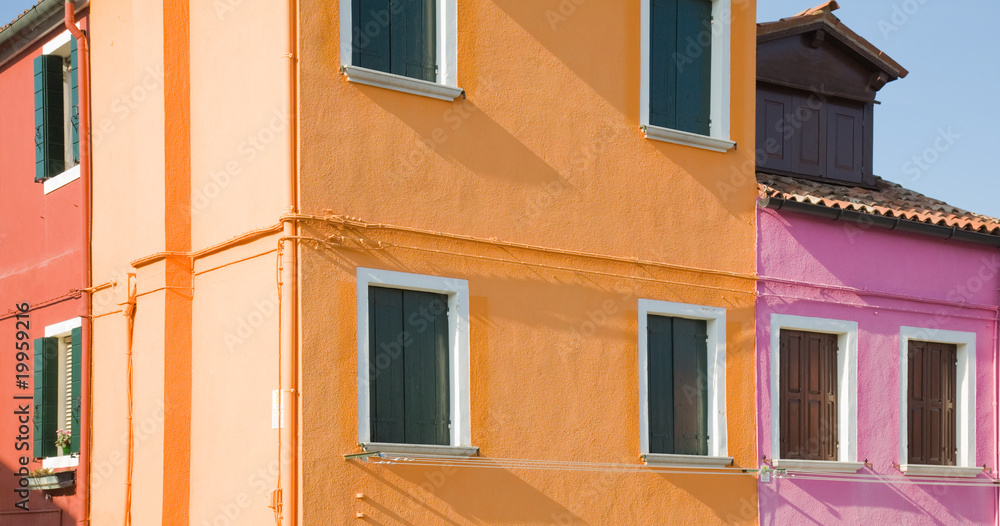 architectural background - Burano island in lagoon of Venice; fa