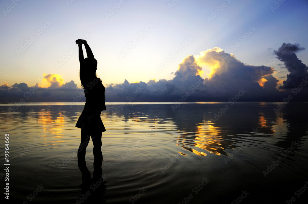Fototapeta premium lady figure with sunset background at Maldives.