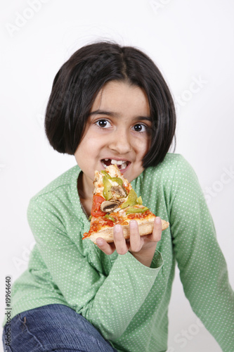 girl eajoying pizza slice