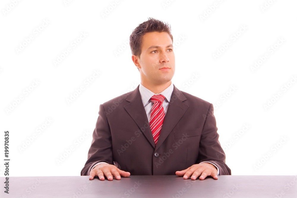 Young business man on a desk, isolated on white Young business man on a desk, isolated on white