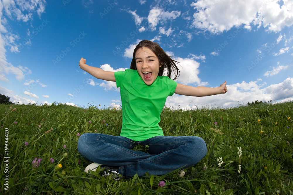 Girl relaxing on green meadow Girl relaxing on green meadow