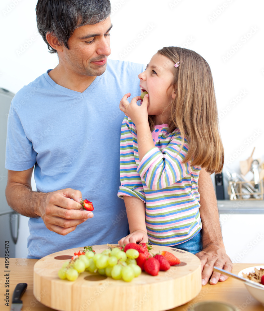 Attractive father and his daughter having breakfast Attractive father and his daughter having breakfast