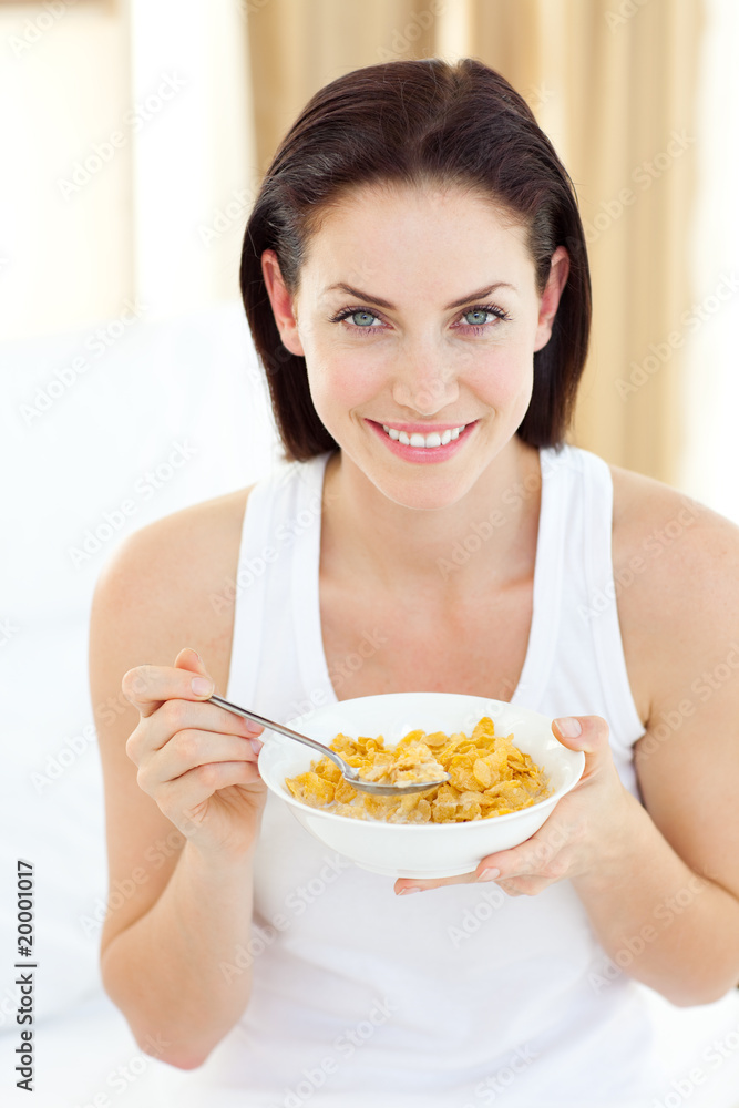 Jolly woman having breakfast