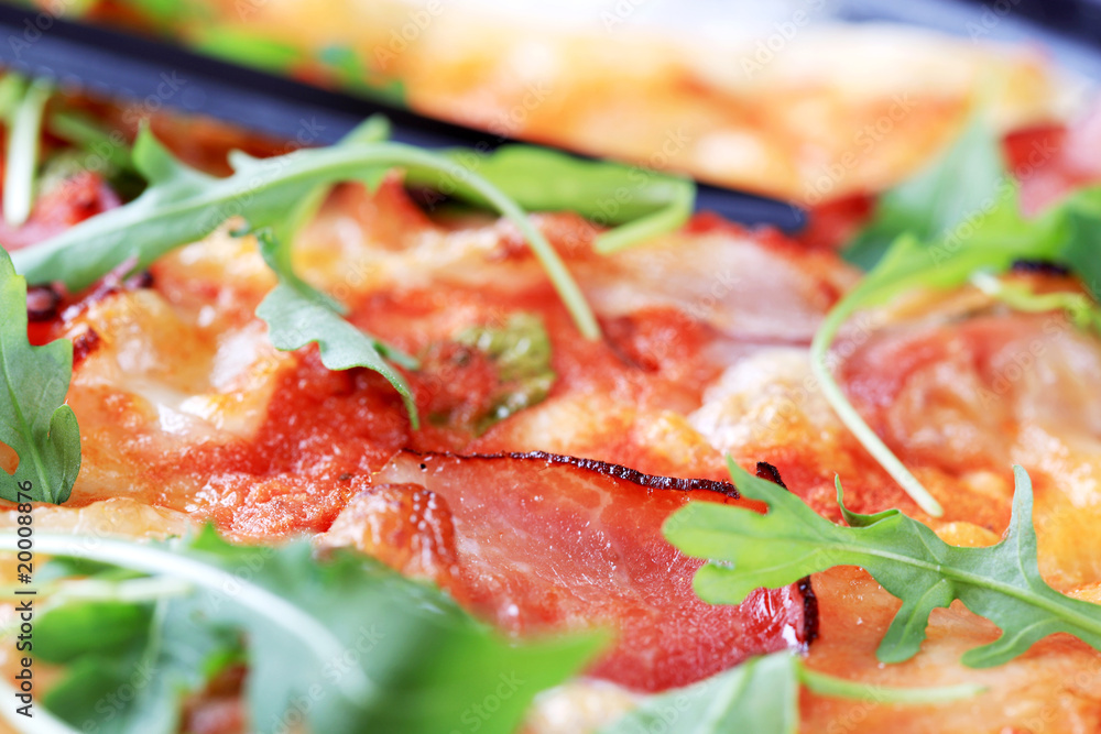 Slices of proscuitto on pizza Slices of proscuitto on pizza