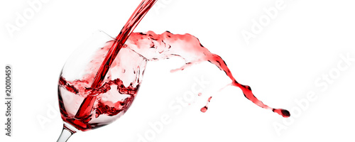 Red wine being poured into a wineglass