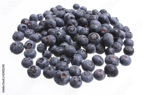 Pile of fresh blueberries isolated on white.