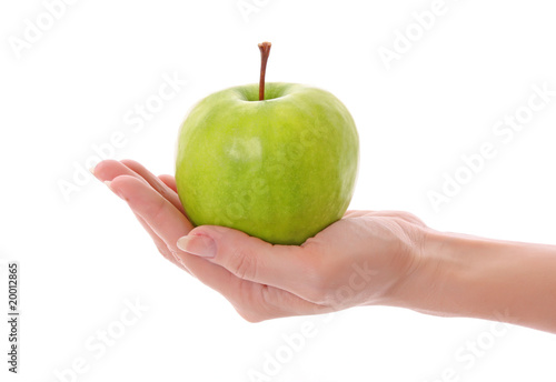Green apple in hand isolated on white