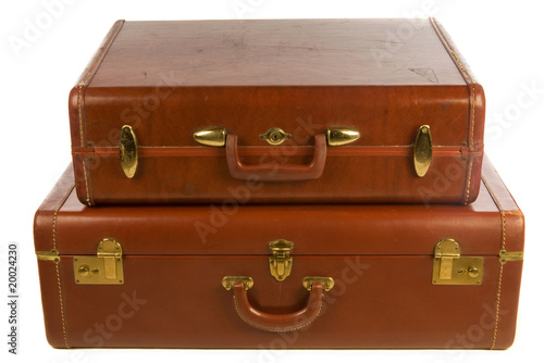 vintage leather suitcases, against white