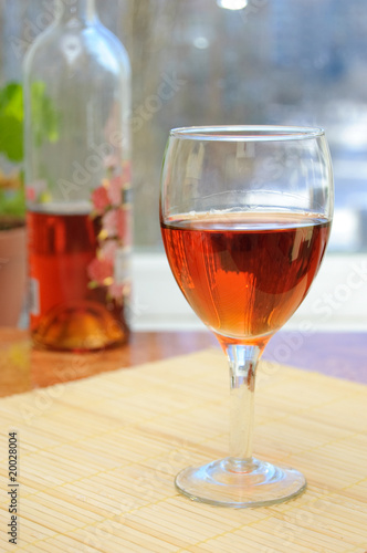 A glass of rosy wine