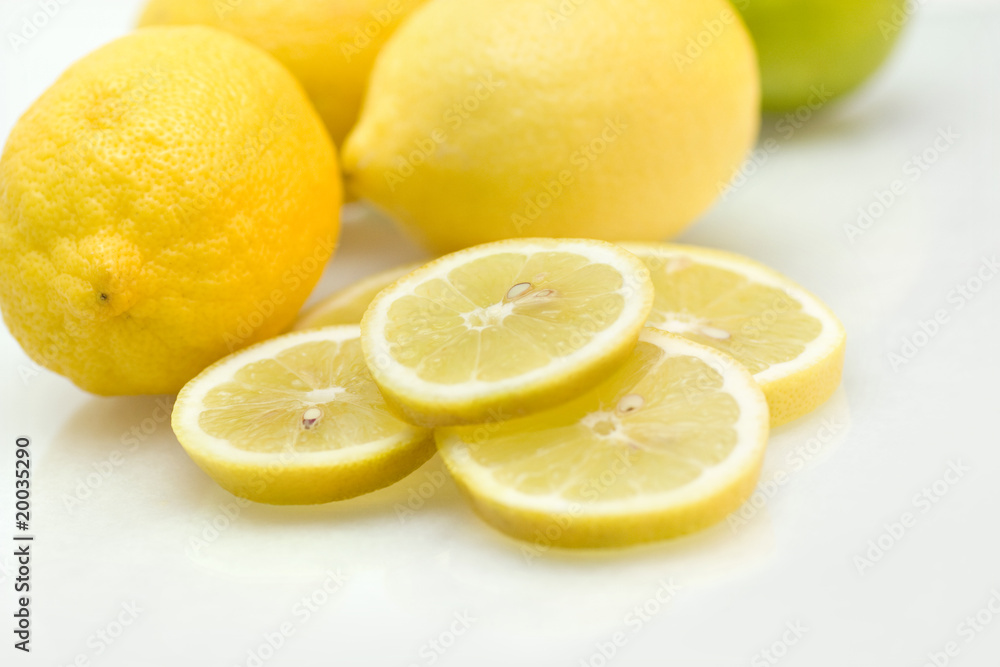 Lemons with slices of lemon and lime Lemons with slices of lemon and lime