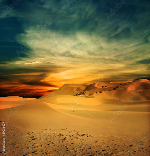 Sandy desert at sunset time