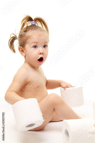 Baby girl with toilet paper