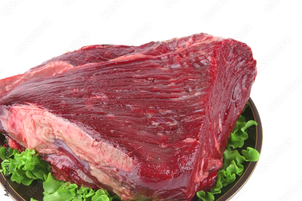 huge uncooked meat on plate