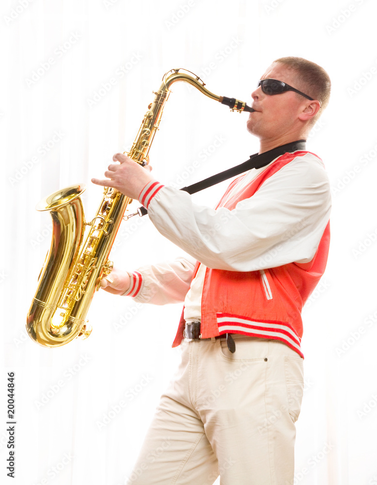 Fototapeta premium A man plays the saxophone