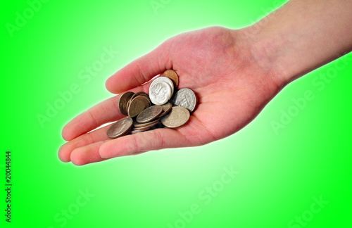 Hand holding pile of coins