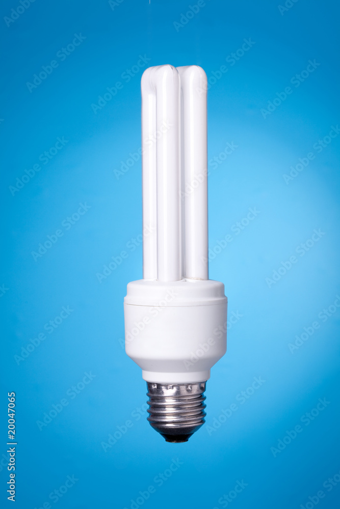 Energy saving lamp on blue background Energy saving lamp on blue background