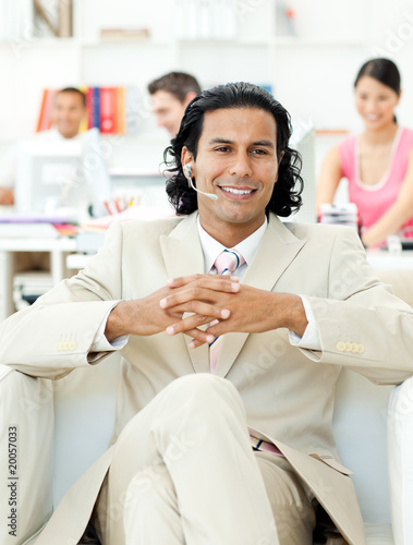 Wallpaper Mural Self-assured manager talking on headset Torontodigital.ca