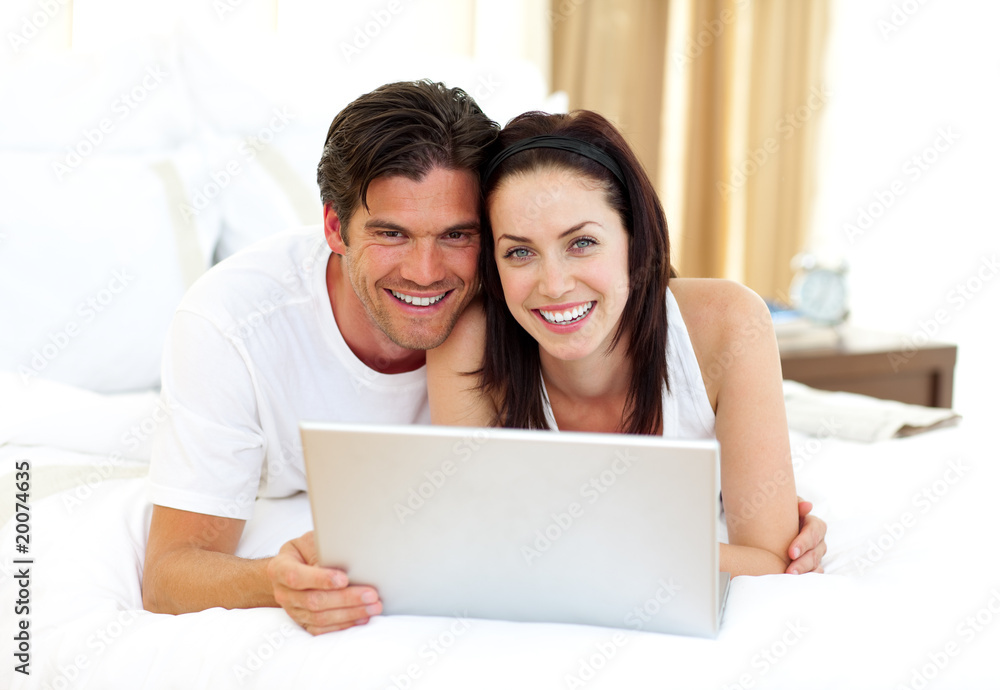 Loving couple using laptop Loving couple using laptop