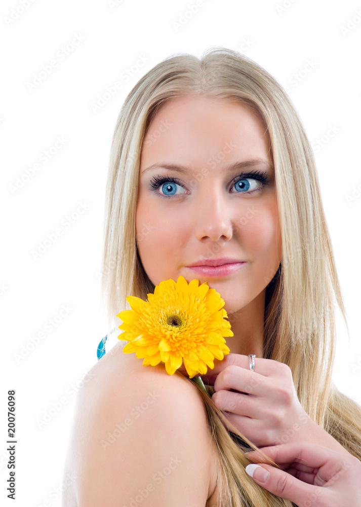 portrait of a beautiful blonde girl with flower.