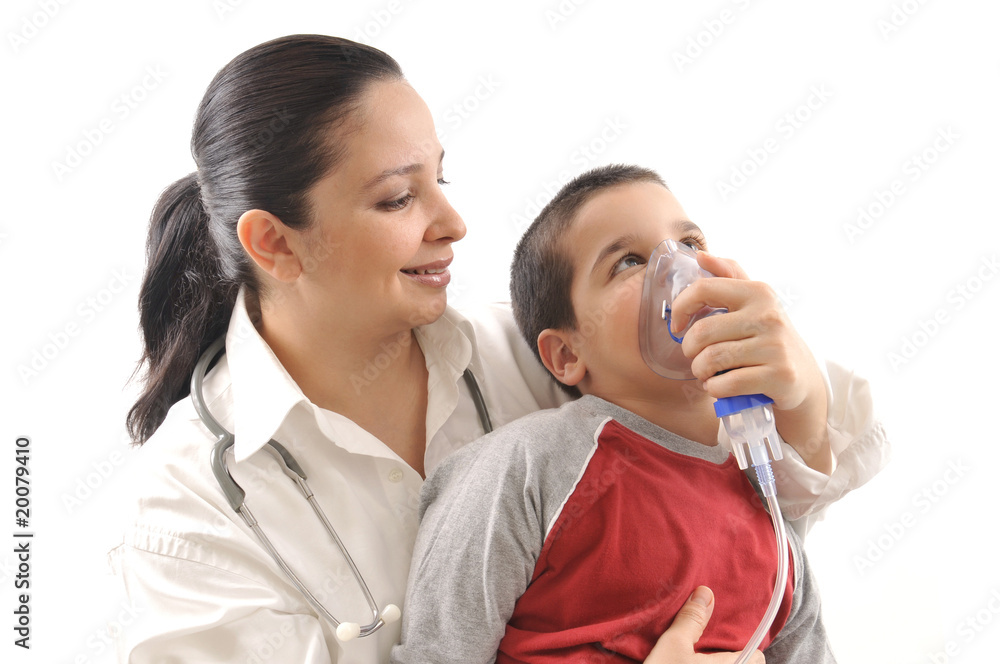 Medical doctor applying oxygen treatment on a boy with asthma. Medical doctor applying oxygen treatment on a boy with asthma.