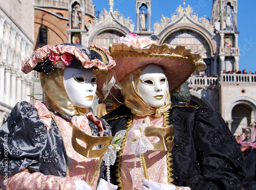 Couple wearing colorful carnival costumes in Venice, Italy © Maresol