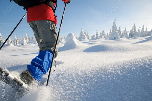 Man with snowshoes photo