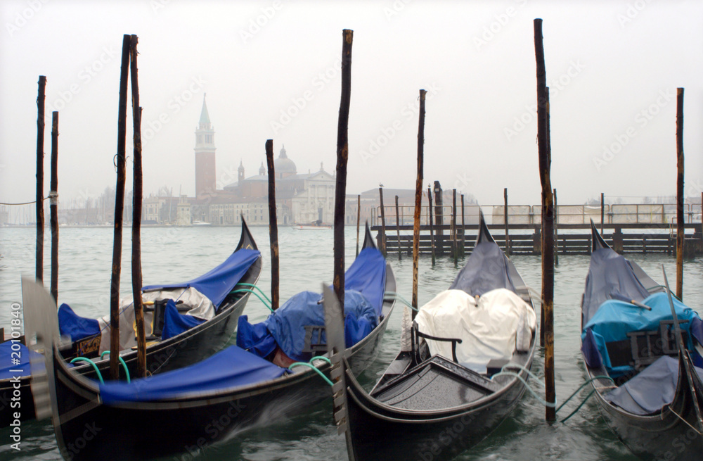 Venice - gondolas and San Giorgio church in winter fog
