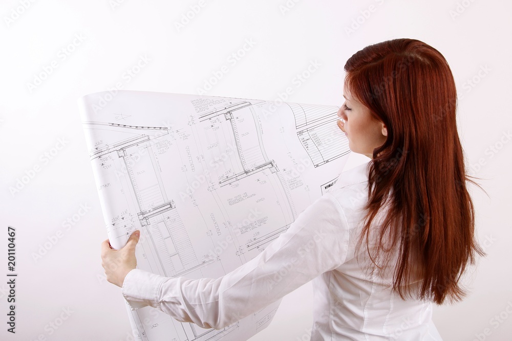 standing woman with house construction plan (focus on plan) standing woman with house construction plan (focus on plan)
