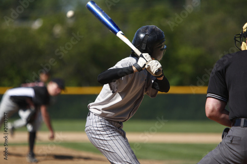 batter about to hit a pitch during a baseball game
