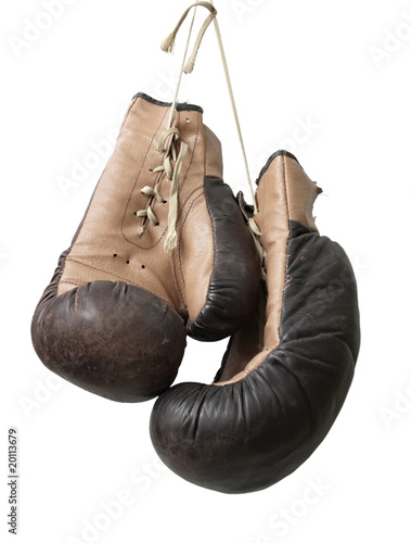 Old boxing gloves hanging on a lace