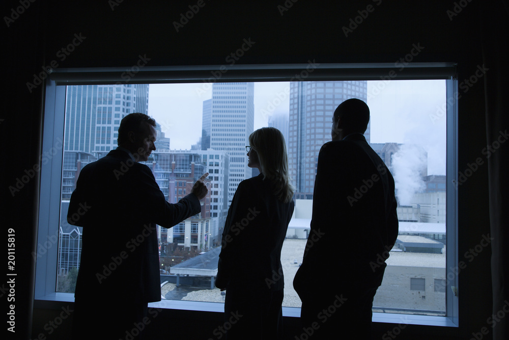 Fototapeta premium Businesspeople Looking Out the Window