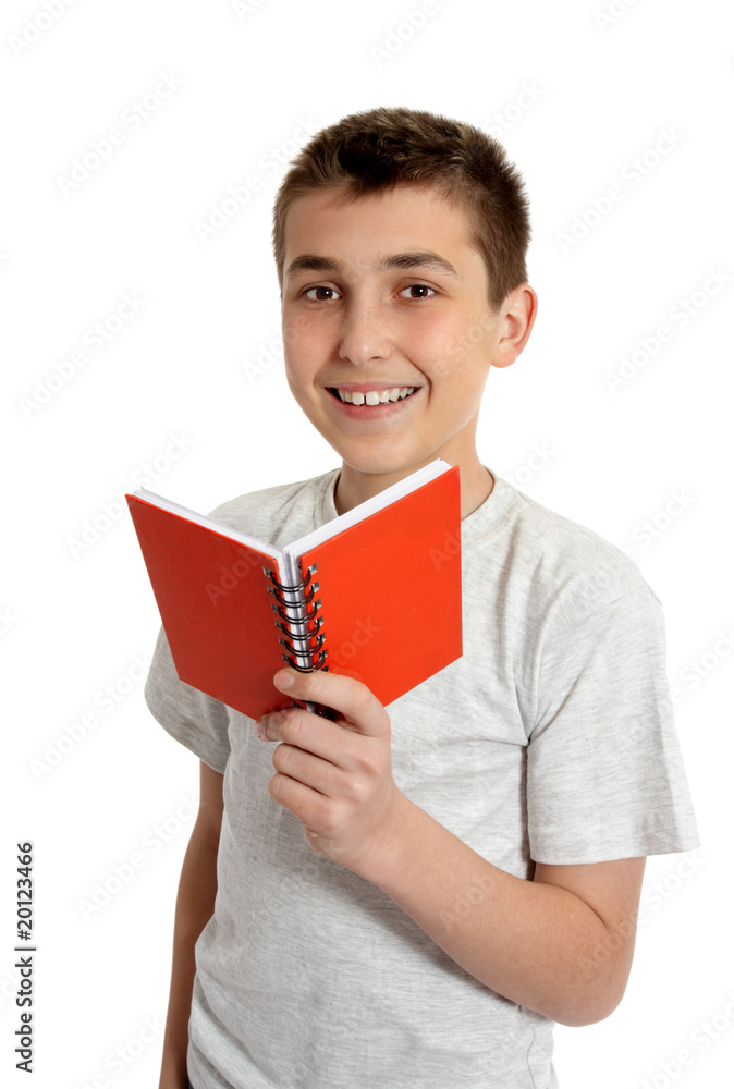 Smiling school student holding small book Smiling school student holding small book