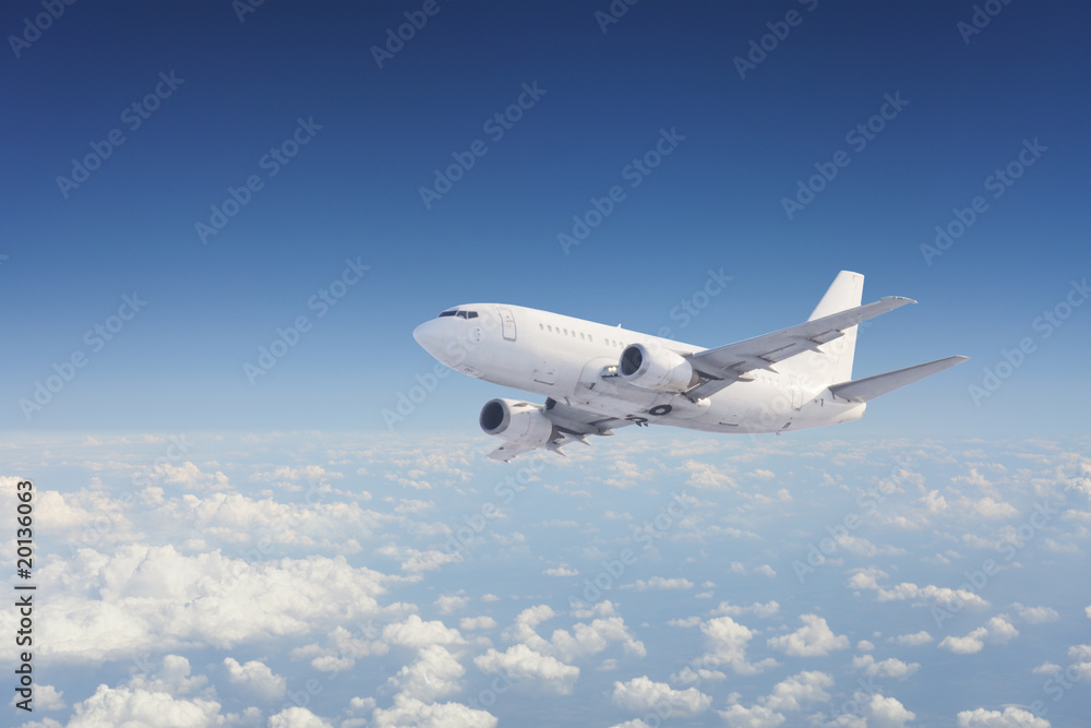 Fototapeta Samolot na niebie, nad pochmurnego nieba