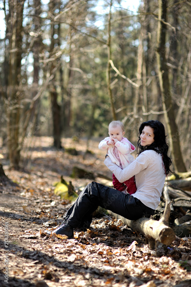 Young woman holding little baby girl Young woman holding little baby girl