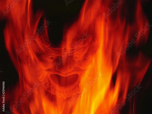 Photos Fireplace burning with Devil mask