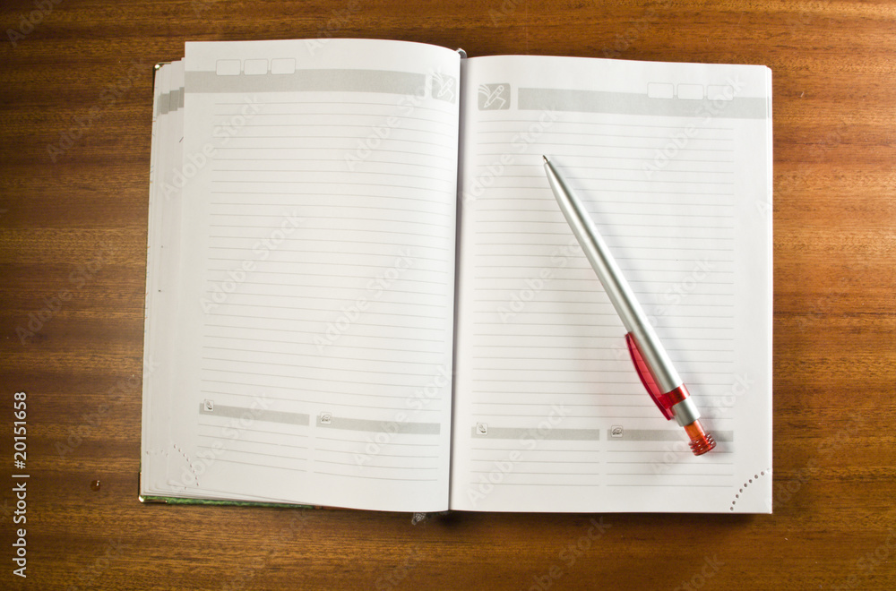 Notebook and a pen Notebook and a pen