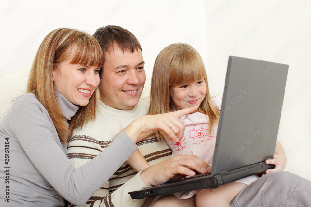 Happy family with laptop