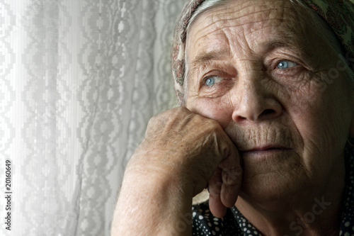 Fotografie, Obraz Sad lonely pensive old senior woman