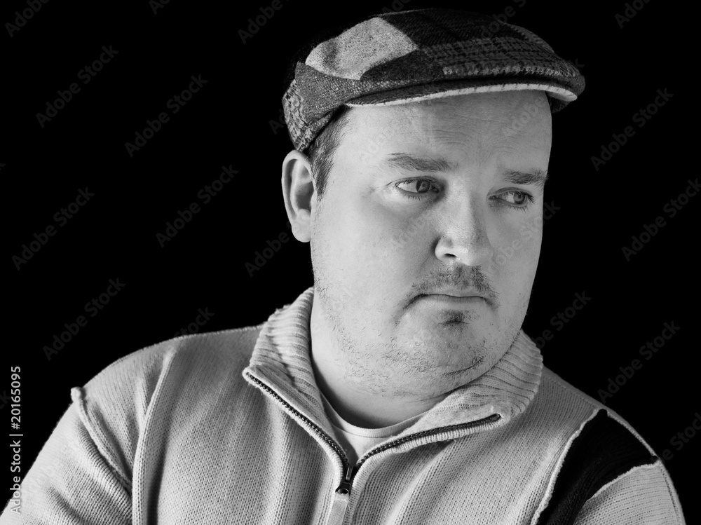 portrait black white of overweight male on black portrait black white of overweight male on black