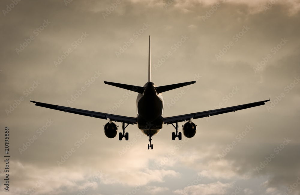 Plane in dramatic evening sky