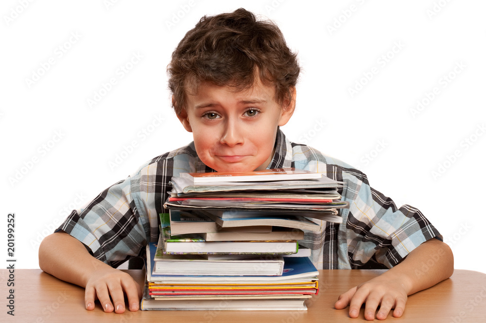Schoolboy displeased by the amount of work he has to do Schoolboy displeased by the amount of work he has to do