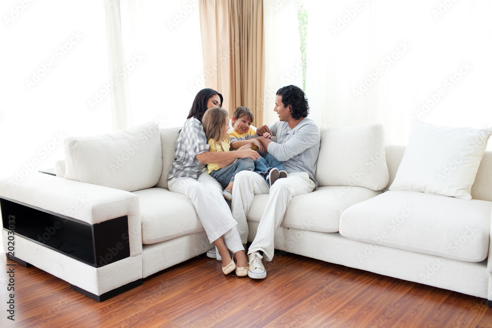 Animated family having fun sitting on sofa Animated family having fun sitting on sofa