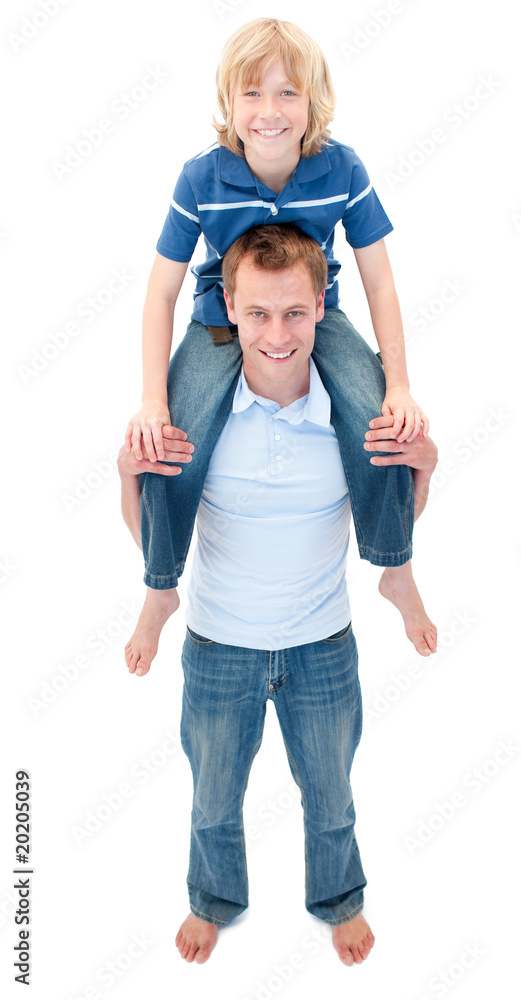 Portrait of father giving his son piggyback ride Portrait of father giving his son piggyback ride