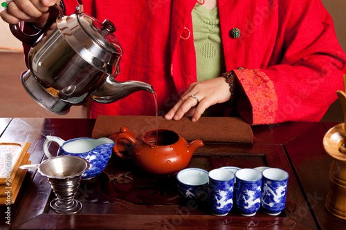 Pouring water for tea photo