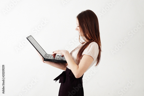 business woman holding a notebook - studio shot