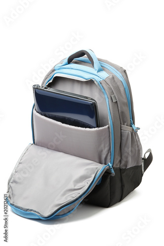 Backpack with a laptop inside isolated photo