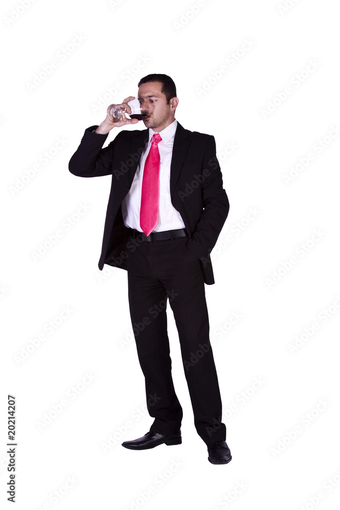 Businessman celebrating with a glass of drink Businessman celebrating with a glass of drink
