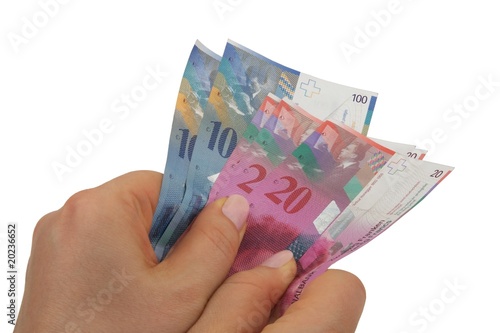 Schweizer Franken Banknoten festhalten