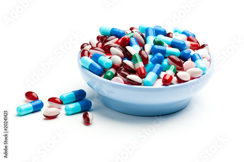 Cuadro en lienzo Bowl of multicolored pills, tablets, and capsules