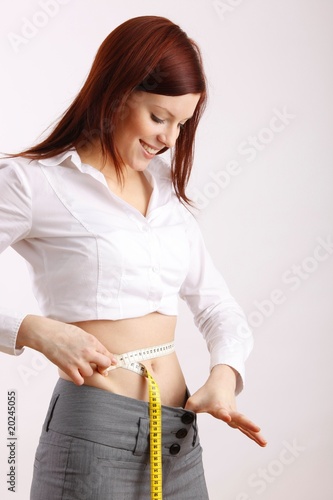 woman with measuring tape around her body